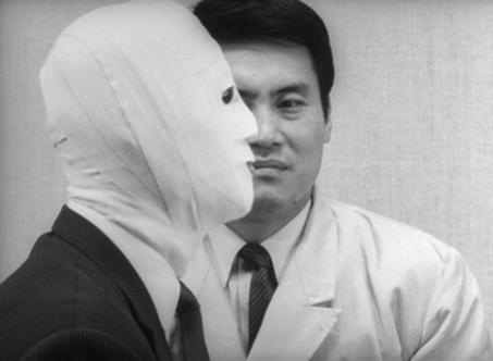To visually evoke Okuyama's identity-split, Teshigahara frequently frames him in a mirror, or fits his face into composition with the face of Dr K, his alter-ego